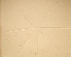 fragment of a brown paper sheet of a box with greasy stains photo