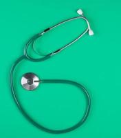 medical stethoscope on green background photo