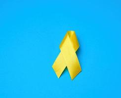 yellow ribbon on a blue background photo