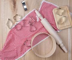 wooden kitchen items on a red towel photo