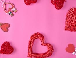 abstract background with red hearts on a pink background photo