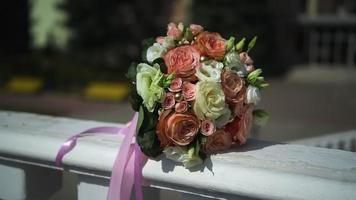 Beautiful wedding bouquet of the bride on a white table video