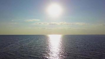 Flying over the sea waves during sunset video