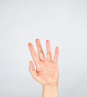 female hand raised up on a white background photo