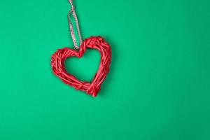 red decorative heart braided from a rod photo