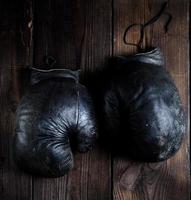 very old black boxing gloves photo