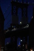 empire state building new york city night view from dumbo photo