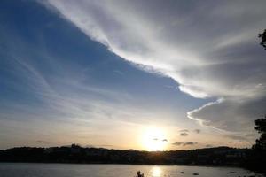 Clouds and light effects in the sky at dawn or dusk. photo