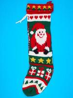 knitted brightly colored Christmas sock for gifts photo