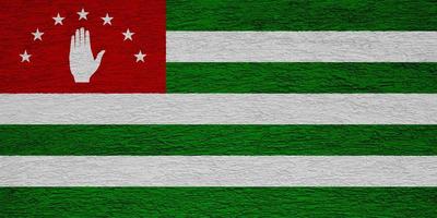 Flag of Abkhazia on a textured background. Concept collage. photo