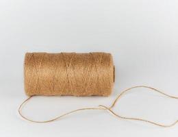 spool-wrapped brown rope of jute photo