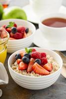 Steel cut oatmeal porridge with fresh berries photo