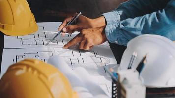 Construction and structure concept of Engineer or architect meeting for project working with partner and engineering tools on model building and blueprint in working site, contract for both companies. video