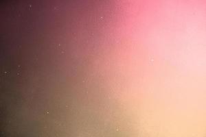 Pink and gold background design texture, gold flecks on yellow pink colorful presentation or wall backdrop, for graphic design, website, banner photo