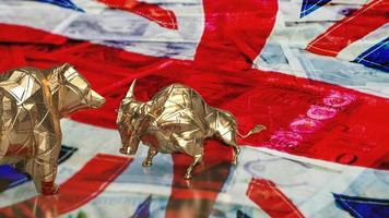 The gold bull bear on uk flag for business concept 3d rendering photo