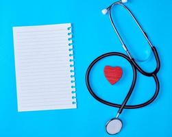 blank white piece of paper in a line and a medical stethoscope photo