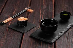 Gunkan Maki Sushi of fish salmon, scallop, perch, eel, shrimp and caviar on wooden table background. Sushi menu. Japanese food sushi set gunkans photo