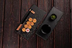 Japanese hot maki roll sushi with tuna top view - asian food concept photo