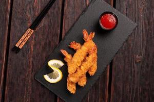 Fried Shrimps tempura with sweet chili sauce - asian japanese food top view photo