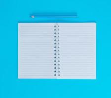 notebook with empty white sheets in line photo