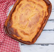 whole rectangular pie of cottage cheese and pumpkin photo