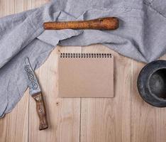 open empty notebook with brown sheets photo