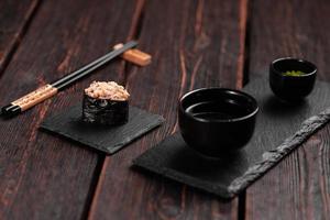 Gunkan Maki Sushi of fish salmon, scallop, perch, eel, shrimp and caviar on wooden table background. Sushi menu. Japanese food sushi set gunkans photo