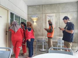 Jakarta, Indonesia in July 2022. People who are FORE coffee buyers are lining up to order the coffee they want. photo
