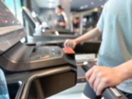 Blur image about exercising on walking treadmill at gym or fitness. Concept for healthy and lose weight. photo