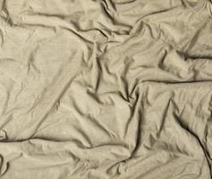 crumpled cotton fabric of gray color, abstract background photo