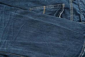 folded blue men's jeans photo