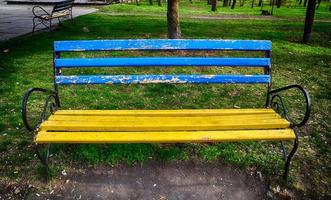 Old wooden bench in the park photo