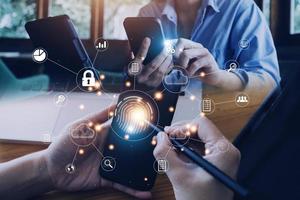 businessmen Fingerprint scanning and biometric authentication, processing of biometric for access personal data. surveillance and security scanning of digital programs cyber futuristic applications photo