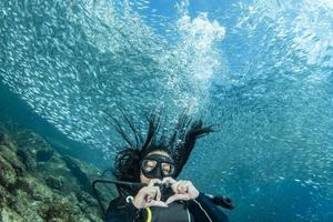 beautiful latina mexican girl diving in cortez sea photo