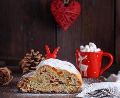 traditional European cake Stollen with nuts and candied fruit photo