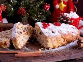 Stollen a traditional European cake with nuts and candied fruit photo