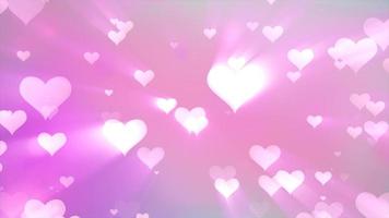 Corazones de amor voladores tiernos y brillantes sobre un fondo rosa para el día de San Valentín. video 4k, diseño de movimiento