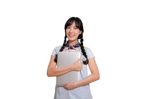 Portrait of beautiful happy young freelance asian woman in denim dress using laptop work with success on white background photo