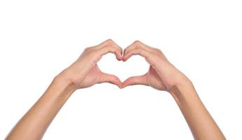 Woman hands making a heart shape on a white isolated background photo