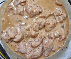 Chicken Satay on noodles with pak choi vegetables photo