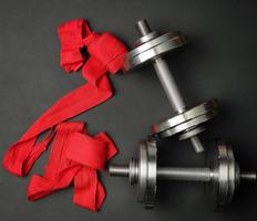 pair of shiny steel typesetting dumbbells for bodybuilding photo