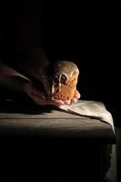 women's hands hold baked round traditional pastry for Easter photo