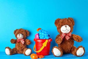 two teddy bears on a blue background photo