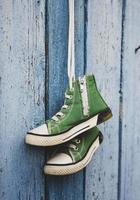 pairs of old textile children's green classic sneakers photo