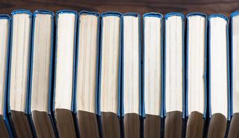 row of books with blue cover photo
