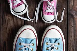 pink kids and adults textile sneakers photo