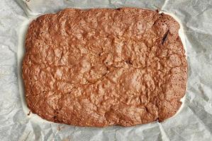 rectangular baked brownie chocolate cake with cracked surface photo