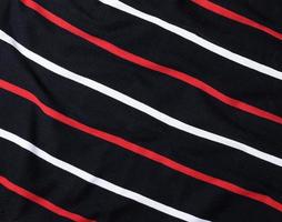 fragment of black cotton striped fabric photo