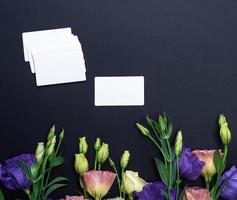 fresh blooming flowers Eustoma Lisianthus and empty paper card photo