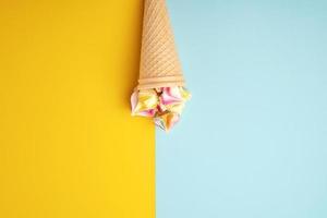 multi-colored baked meringues in a waffle cup photo